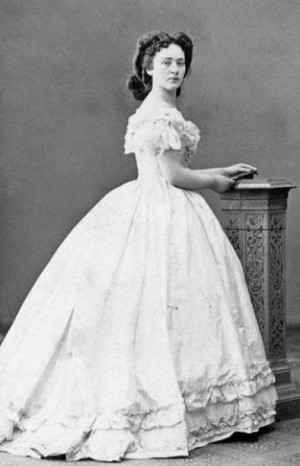 Young Bertha wears a typical crinoline evening dress, probably from ...