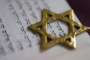 Golden Star of David, a Jewish symbol, over the first word of the ...