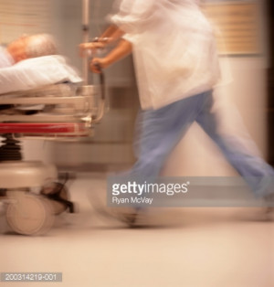 Royalty-free Image: Medical staff moving patient on bed in hospital…