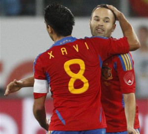 xavi and iniesta andres iniesta celebrating his goal with xavi