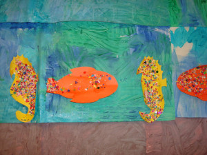 ... group project, and added confetti pieces to fish and sea horse shapes