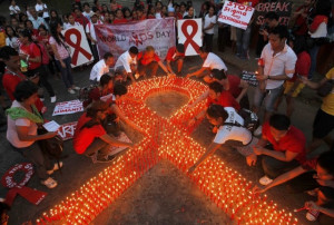 supporters of people living with hiv and aids light candles