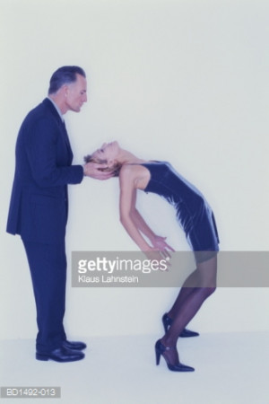 ... -Res Stock Photography: Man supporting head of woman bending over