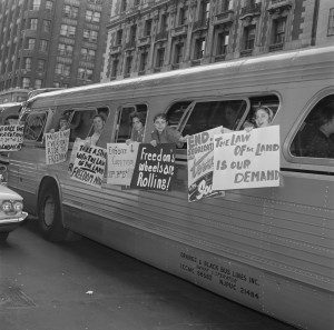 Members of the Washington Freedom Riders Committee hang signs outside ...