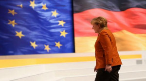German Chancellor Angela Merkel, walks past flags of the European ...