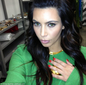 Green eyed envy: Kim tried on some green contacts which looked ...