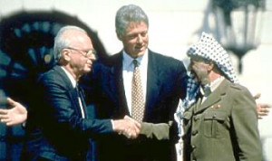 Left: The historic handshake between Rabin and Arafat in Washington]