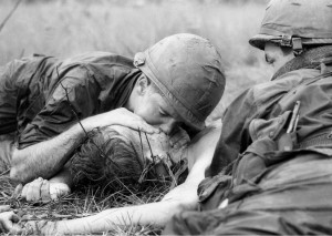 ... mouth-to-mouth resuscitation to a dying soldier. (AP Photo/Henri Huet