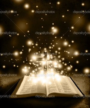 Glowing Bible with Cross on Brown Backround - Stock Image