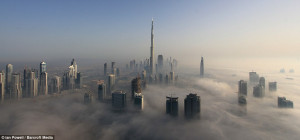 The city in the clouds: Dramatic images of Dubai's skyscrapers poking ...