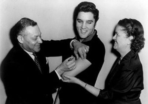 Elvis Presley receives the polio vaccine.