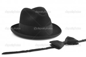 Black vintage hat and bow-tie on white background - Stock Image