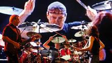 Canadian rock band Rush guitarist Alex Lifeson (L), drummer Neil Peart ...