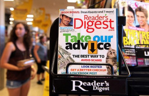 copy of Reader's Digest magazine is displayed on a rack at a grocery ...