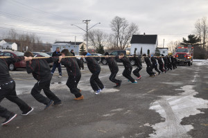 The Scotsburn Major Bantam Crushers pull a fire truck that weighs 9 ...