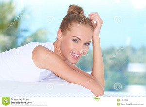 Closeup facial expression of a beautiful high-spirited woman laughing ...