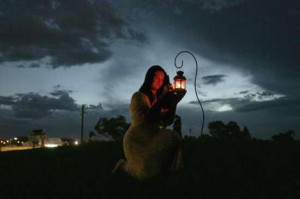 Moonstruck … as a thunderstorm rages, a Sydney pagan lightslanterns ...