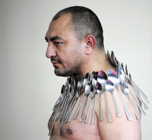 man attempts to set the world record for the most spoons on a human ...