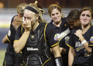 Mizzou softballs players crying after a playoff loss.