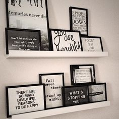 IKEA picture frame shelves and lots of framed quotes/sayings