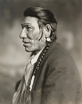An old photograph of a Blackfoot Indian.