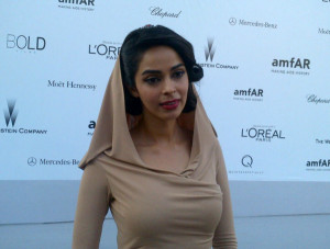 Mallika Fully dressed up at AmFar Gala at Cannes 2012