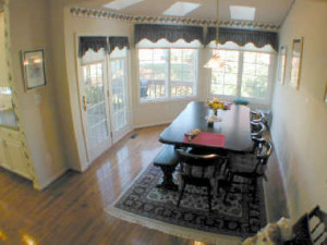 morning room with hardwood floors skylights french doors to deck