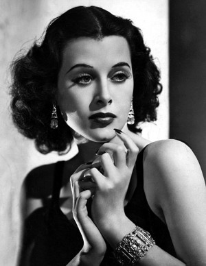 Actress Hedy Lamarr clad in jewelry looks (1938). Drop earrings and ...