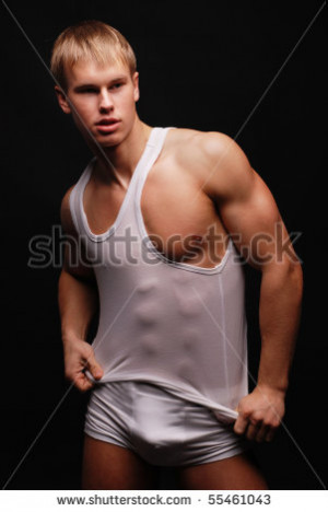 Muscled male model posing in studio - stock photo