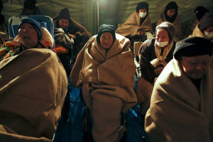 Picture of tsunami survivors wrapped in blankets at a hospital in ...