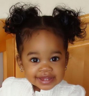 beautiful black baby girl with her pretty hairstyle with a sweet smile ...