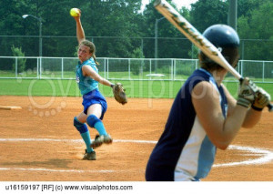 Female Softball Player Pitching To A Batter