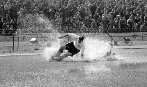 football in the rain reminds me of the famous Tom Finney photo - and ...