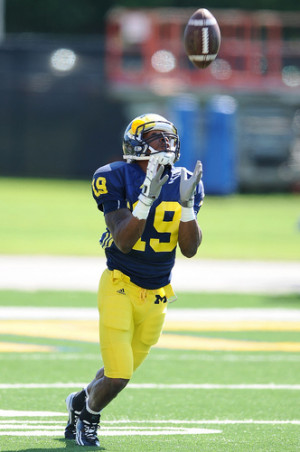 Michigan senior wide receiver Kelvin Grady hauls in a kickoff during a ...