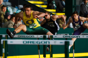 Oregon freshman Devon Allen clears the hurdle in the men's 110 meter ...