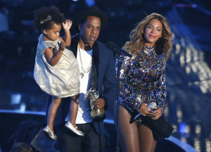 Jay-Z presents the Video Vanguard Award to Beyonce as he holds their ...