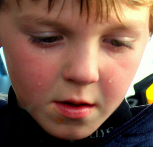 Description A child sad that his hot dog fell on the ground.jpg