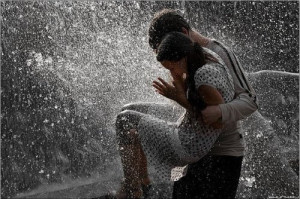 Cute couples playing in rain