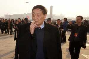 Zong Qinghou, China's richest man, stands outside the opening of this ...