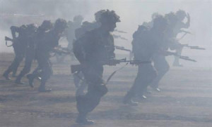 Indian army soldiers perform a mock combat drill on the first day of a ...