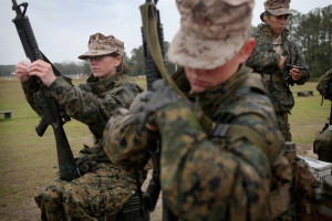 Female Marines shoot rifles and swim in uniform at boot camp