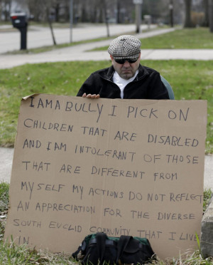 Ohio man holds sign declaring he's a bully as punishment for harassing ...