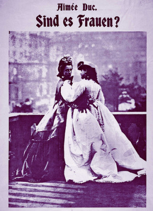 Two women in nineteenth century costume in affectionate pose. image ...