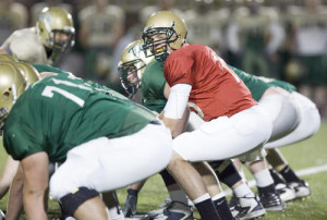 William and Mary quarterback R.J. Archer lines up behind the center ...
