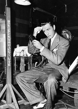 Paul Henreid on the set of Now, Voyager (1942).