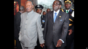 Zambian President Michael Sata (L) and Zimbabwe's President Robert ...