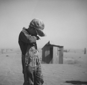 Dust Bowl photographs by Arthur Rothstein A young boy covers his mouth ...