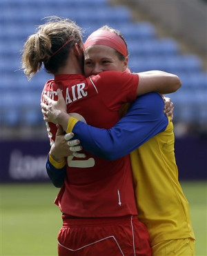 Canada goalkeeper Erin Mcleod, right, hugs teammate Christine Sinclair ...