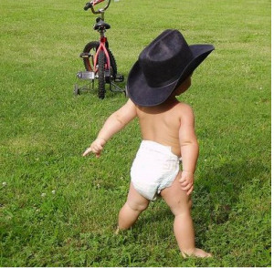 Funny baby wearing a big black cowboy hat png 1 comment