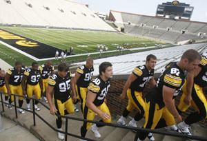 Iowa players file out of Kinnick Stadium after the team photo ...